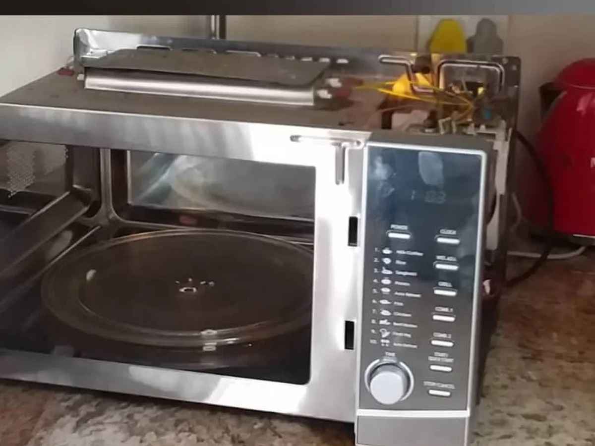 Stainless steel microwave oven on a kitchen counter